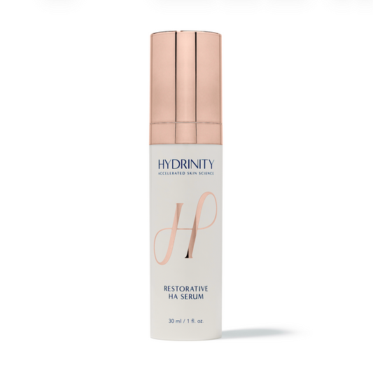 Hydrinity Restorative HA Serum 30 ml bottle with a rose gold cap available at KOZA Skin Clinic, Port Coquitlam, Tri-Cities BC