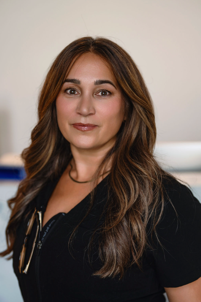 Professional portrait of a KOZA Skin Clinic team member in clinic uniform at KOZA Skin Clinic, Port Coquitlam, Tri-Cities BC